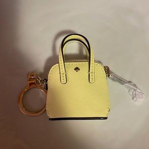 NWT Kate Spade purse key chain in pastel yellow with gold accents